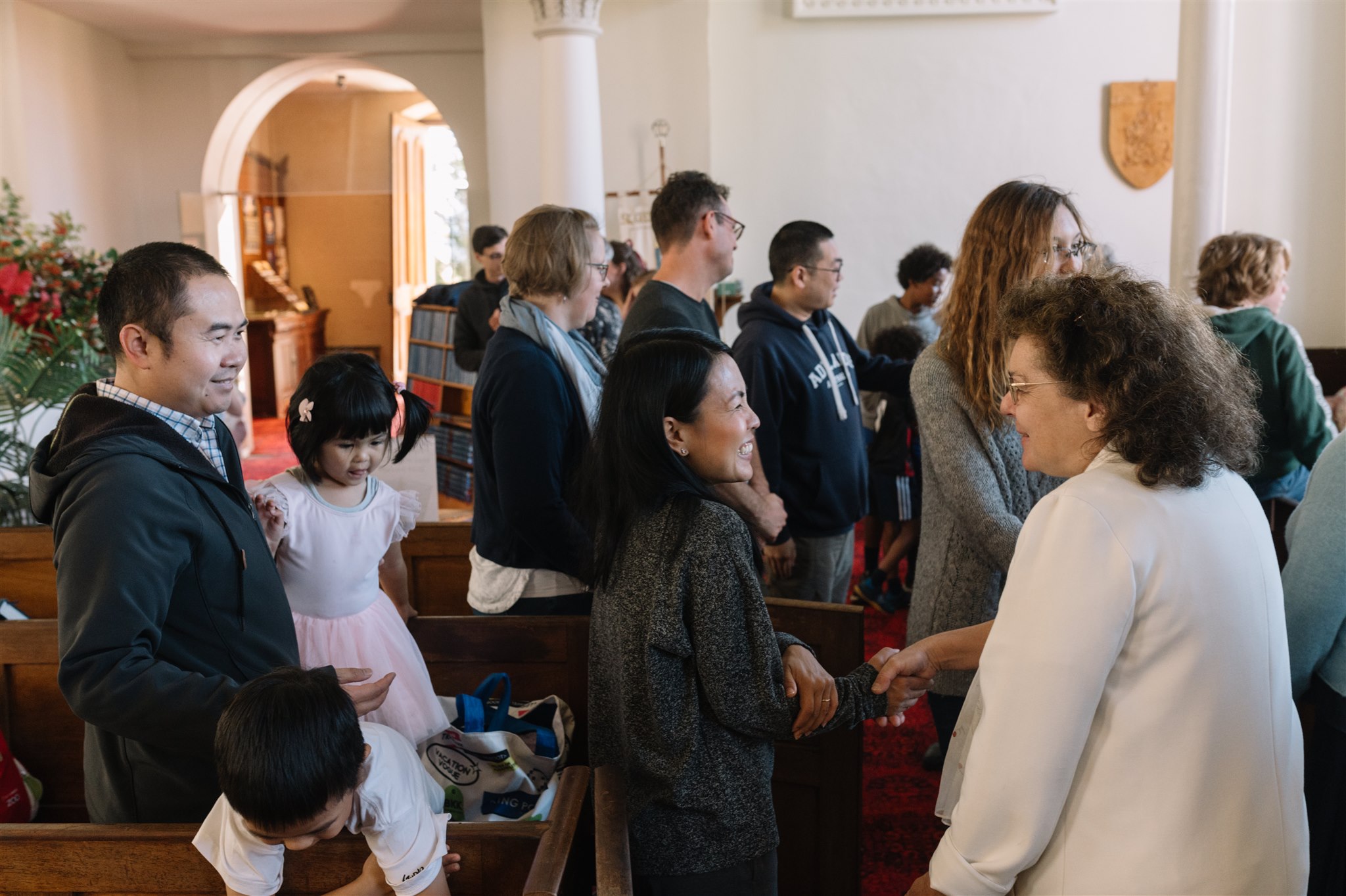 People meeting and greeting at church