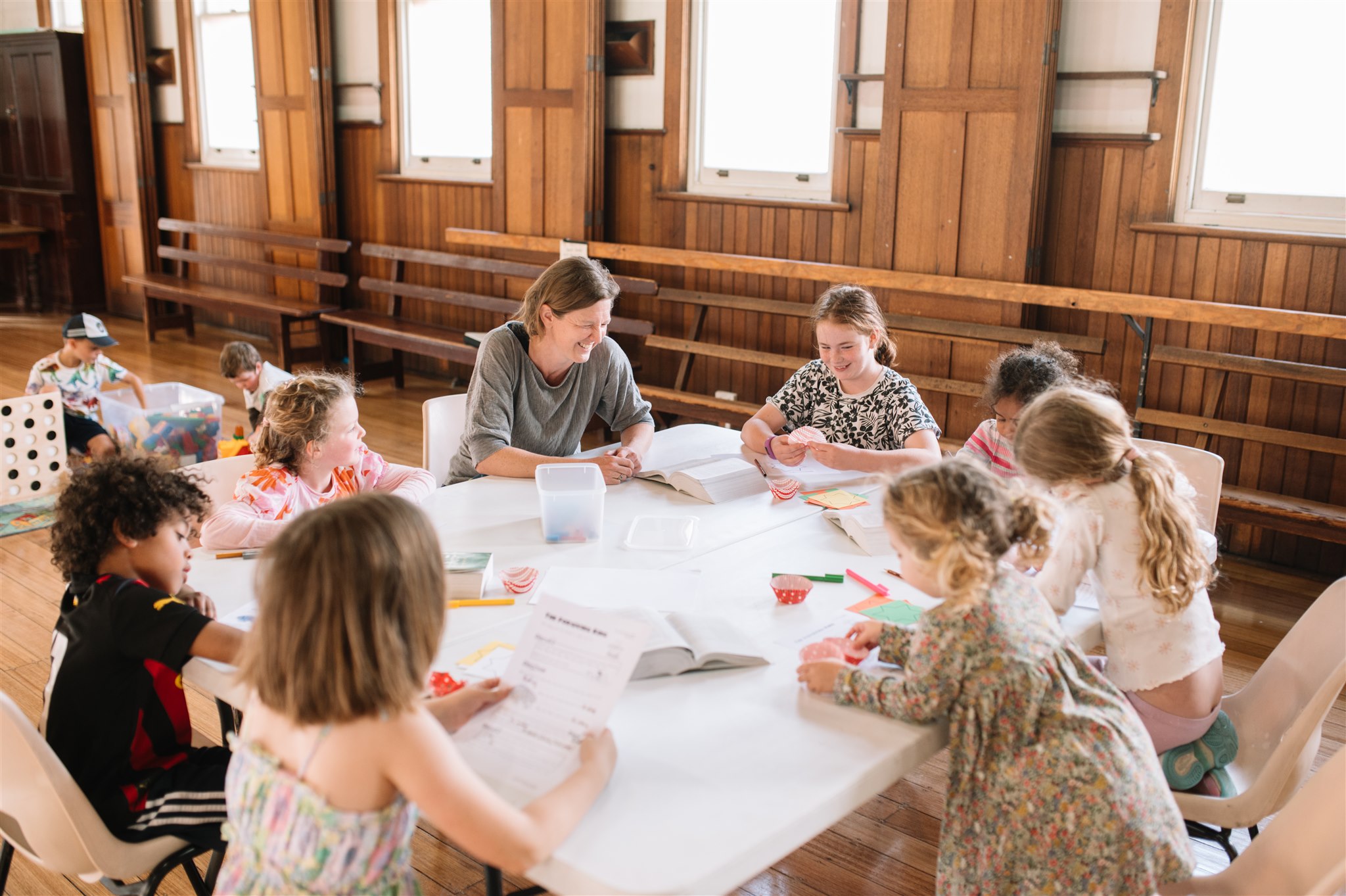 Kids sitting around a table at church doing craft