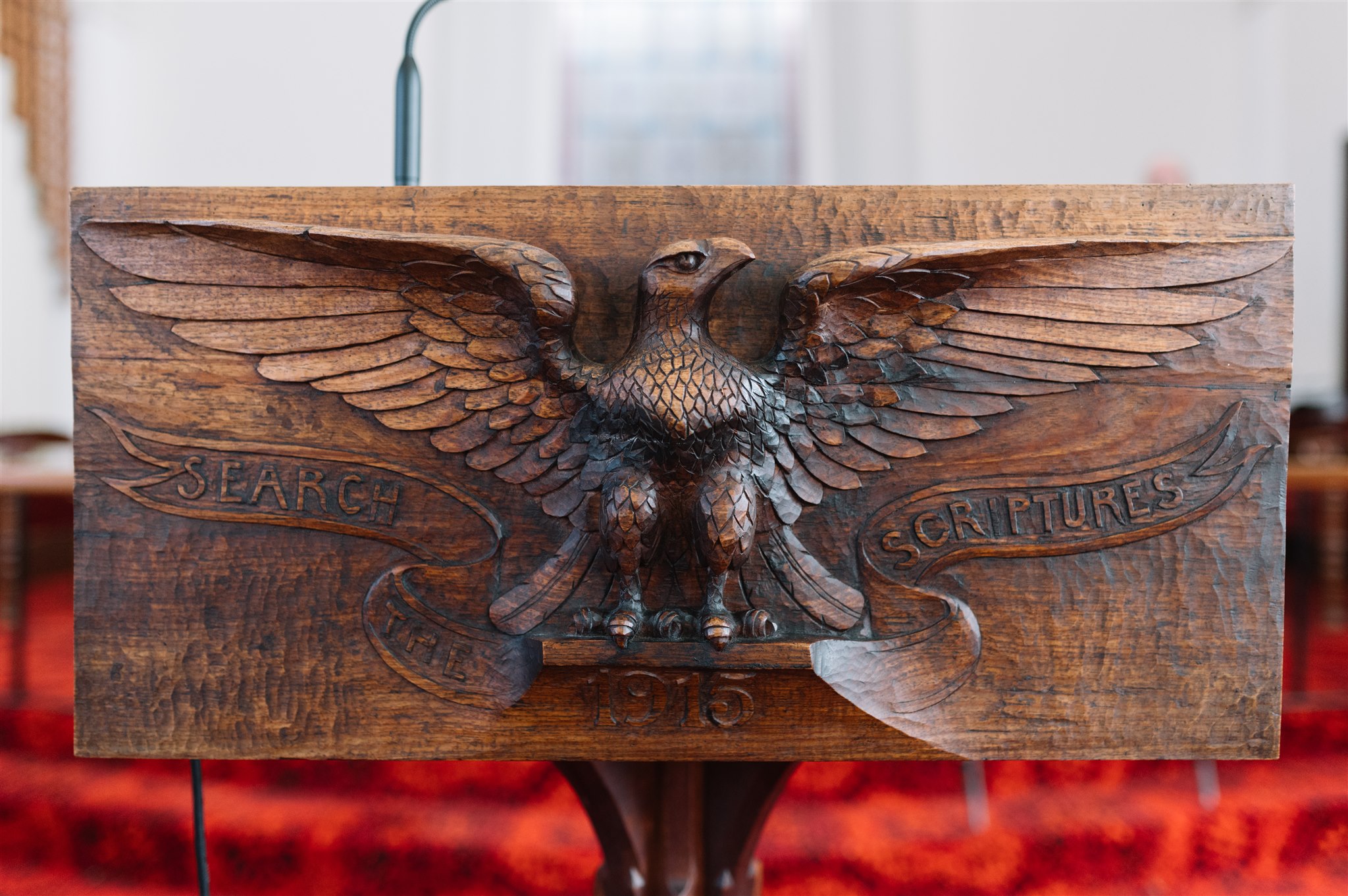 An eagle carved into our wooden pulpit