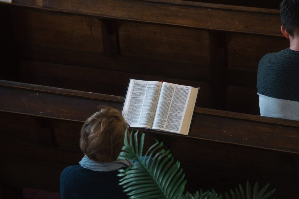 A lady reading her Bible during church