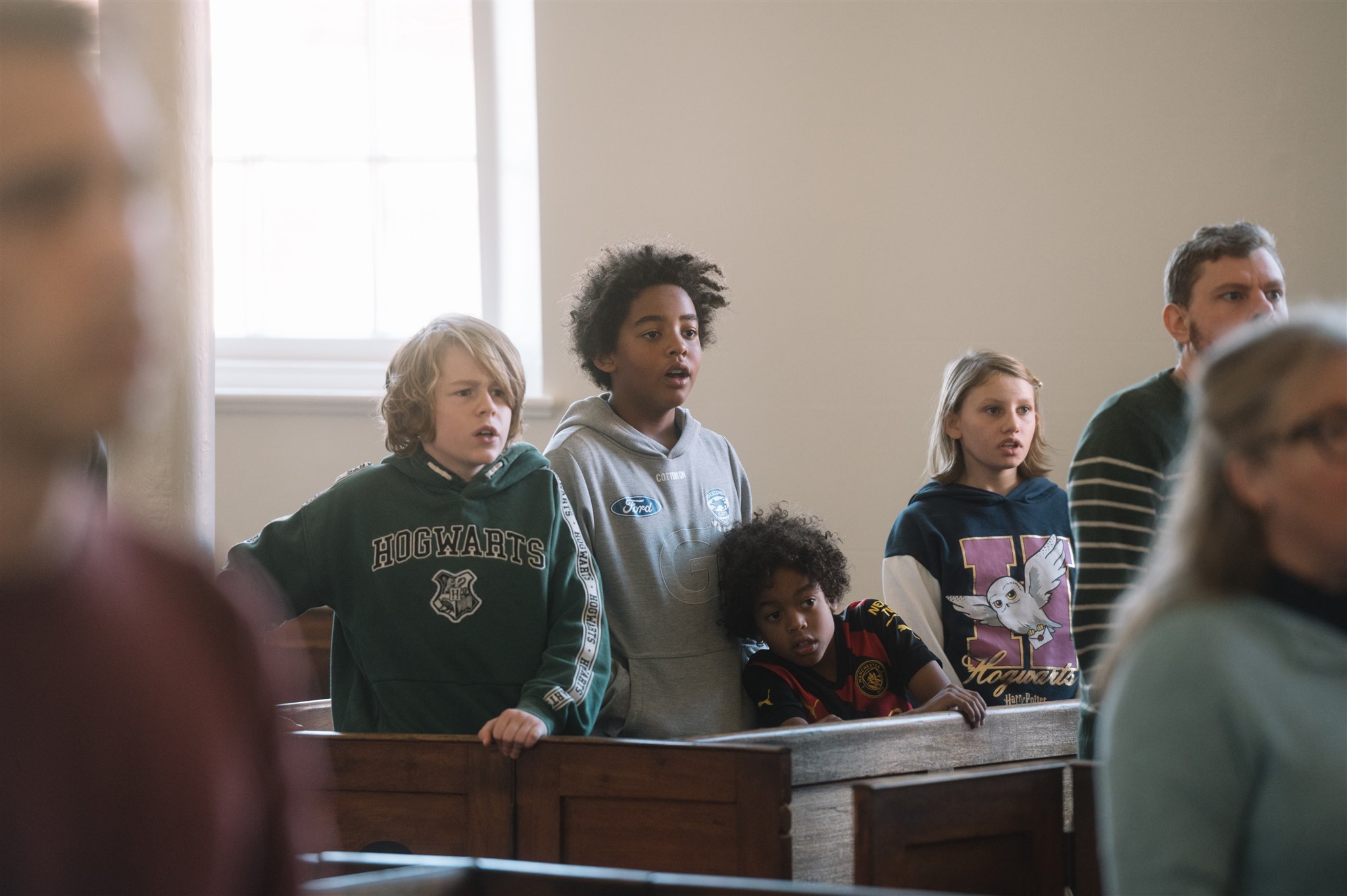 A group of youth singing in church